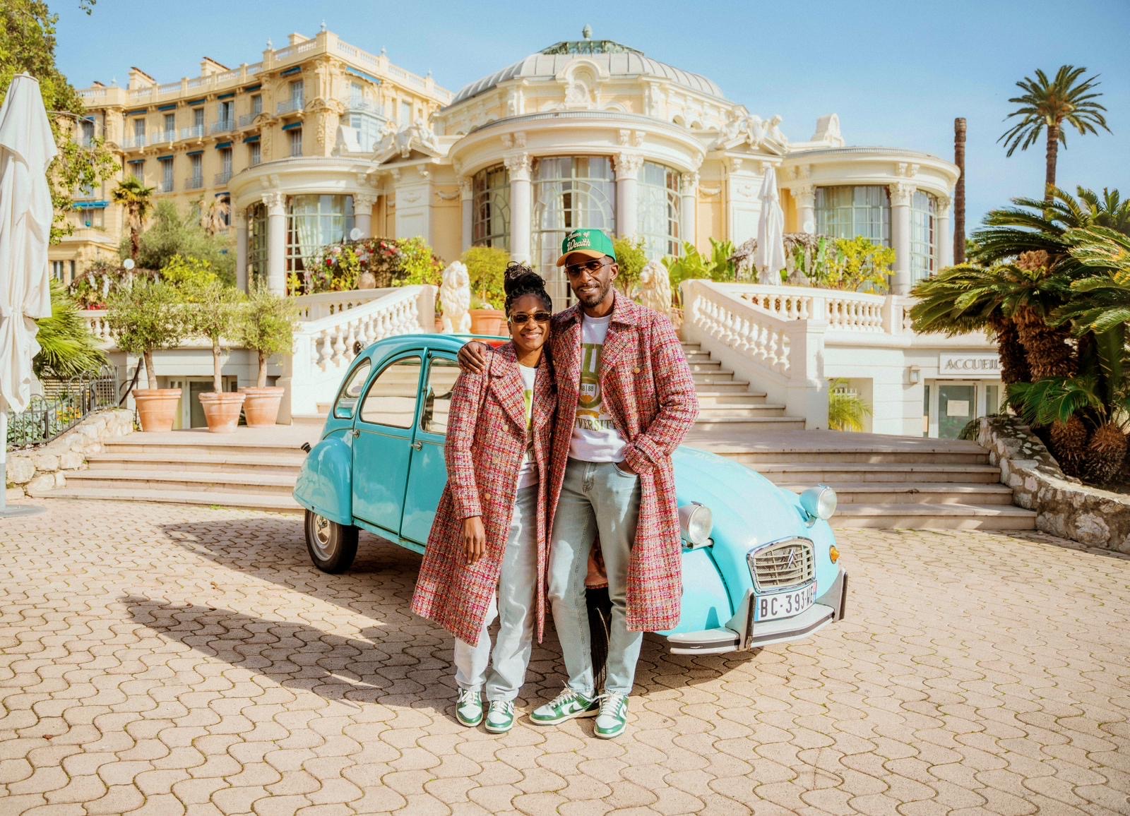 Couple in front of 2CV Citroën car in Beaulieu-sur-mer Circé restaurant on the French Riviera