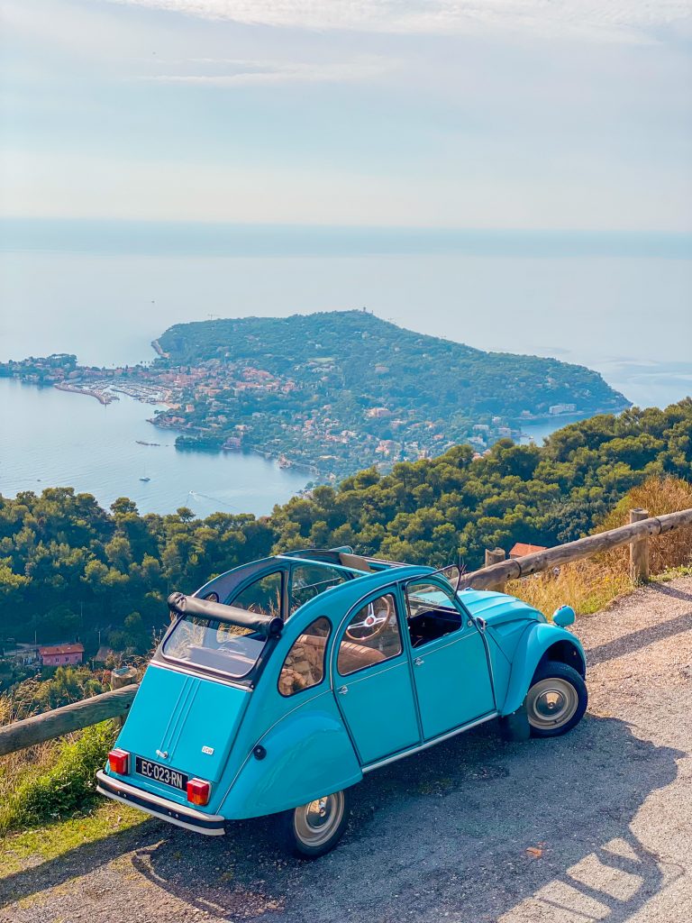 Saint-Jean-Cap-Ferrat, peninsula of the French Riviera, seen from a blue 2CV Citroën car